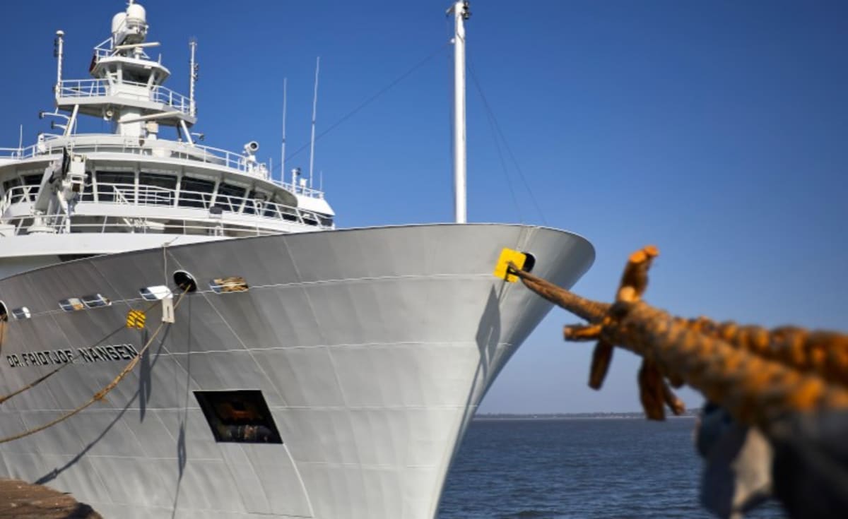 Large white research vessel Dr. Fridtjof Nansen docked at port with scientific equipment visible on deck