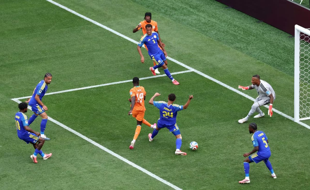 Côte d'Ivoire soccer players celebrating historic World Cup knockout stage qualification in Philadelphia