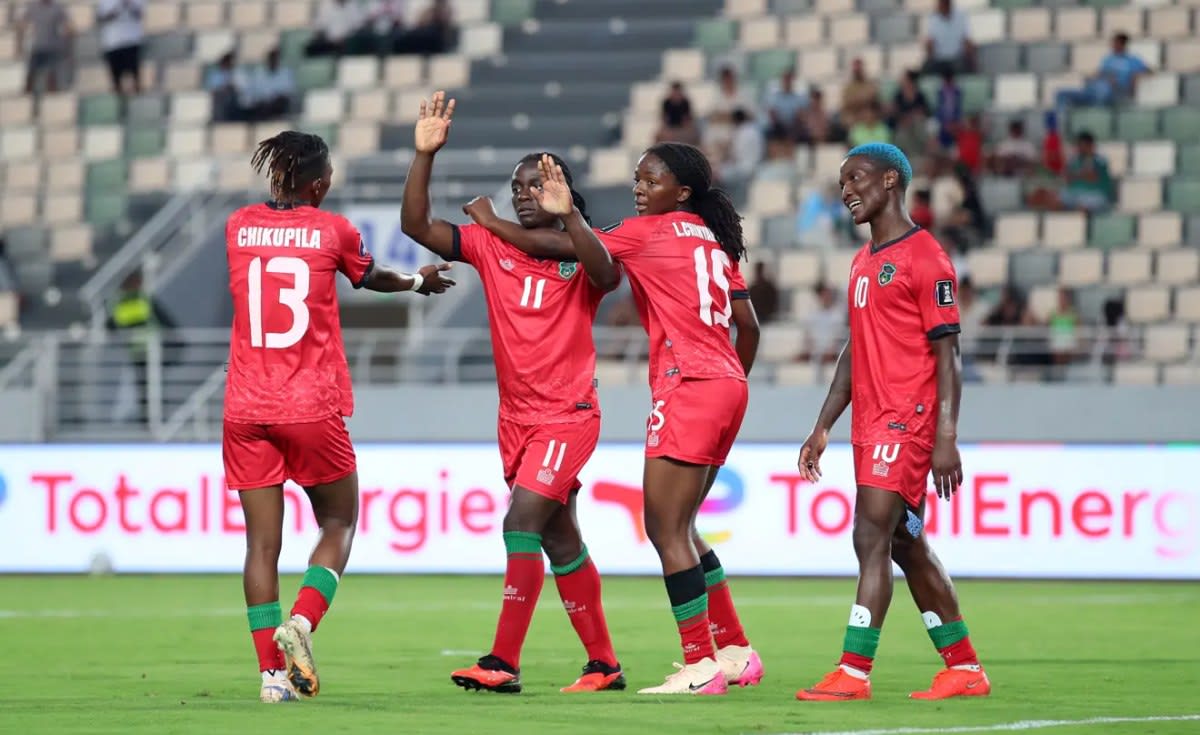 Malawi women's football team celebrating their historic first WAFCON final qualification together
