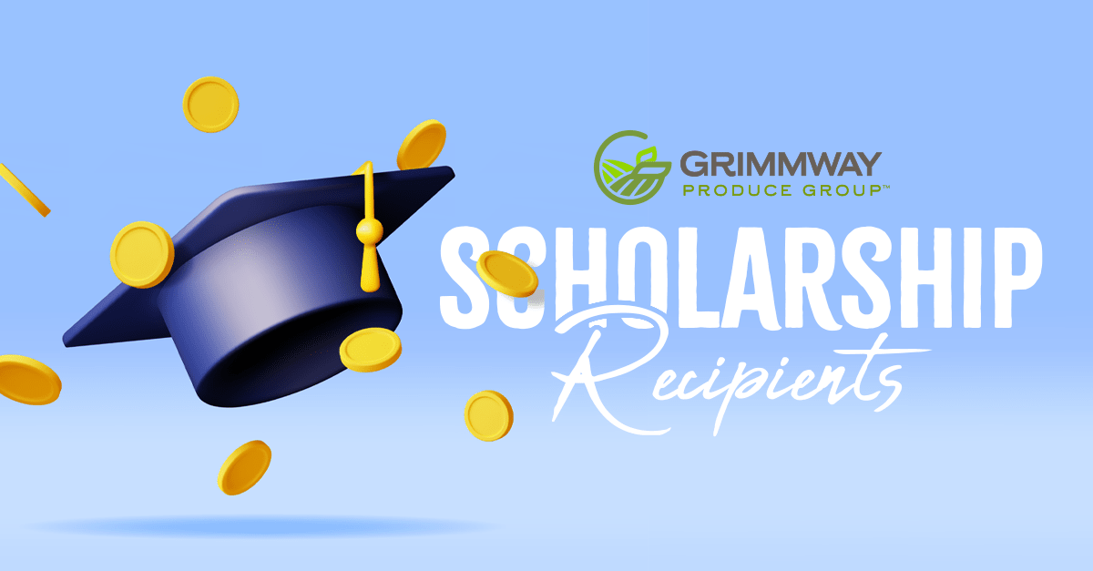 Group of smiling scholarship recipients holding certificates at outdoor family picnic ceremony