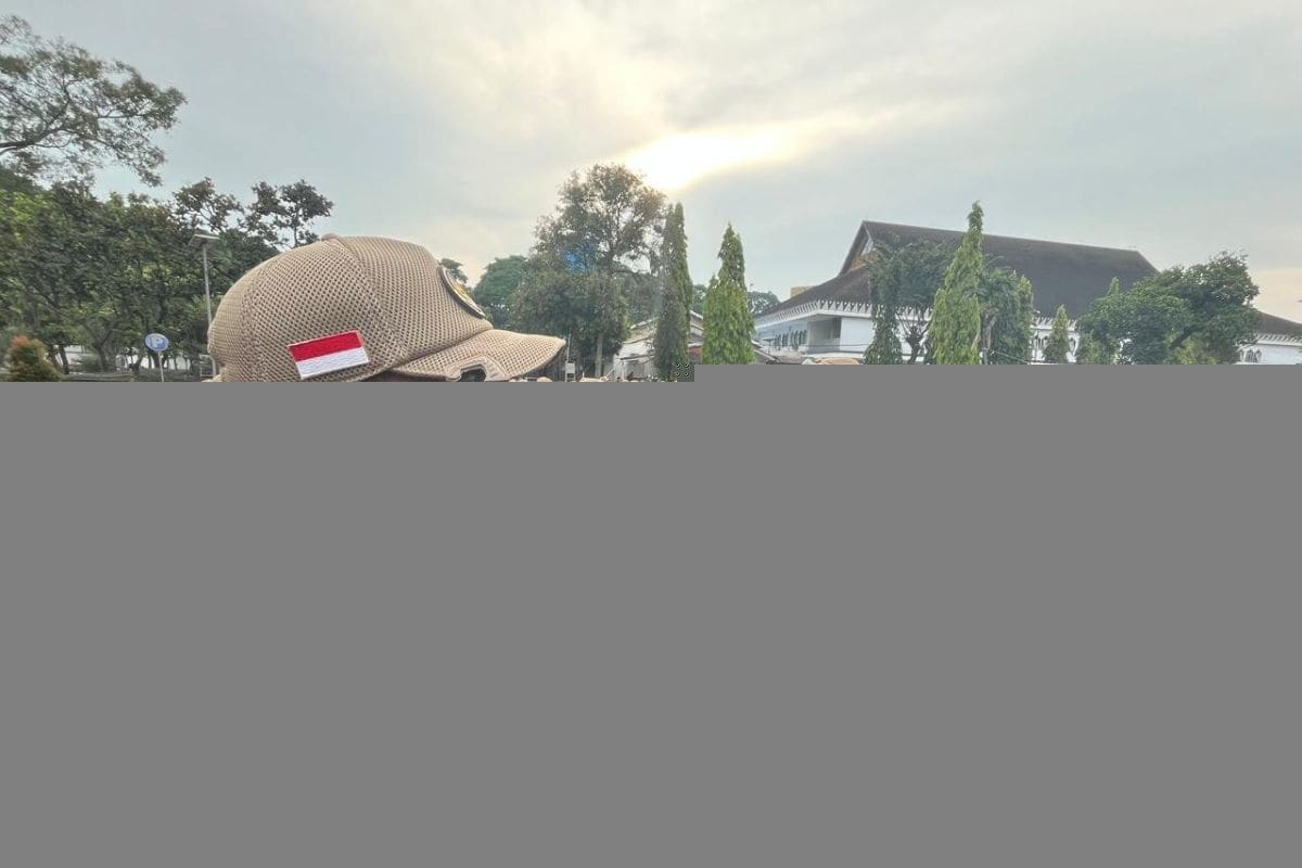 Indonesian Hajj officers in uniform attending ceremony before departing to serve pilgrims in Mecca