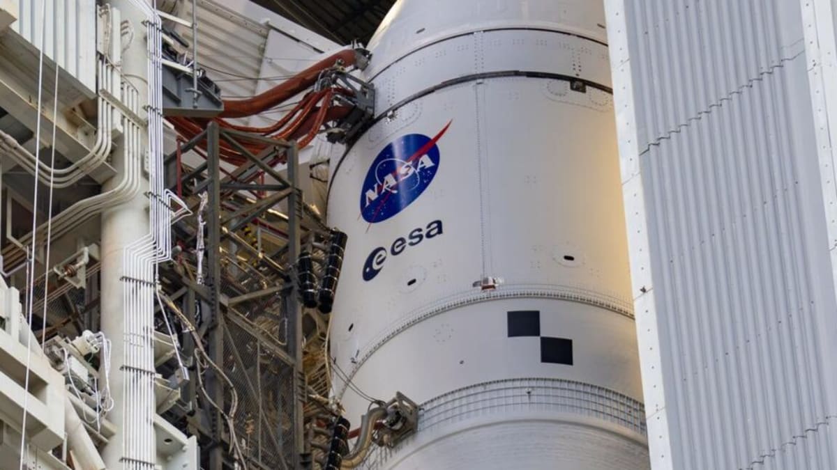 NASA's Space Launch System rocket stands tall inside Vehicle Assembly Building awaiting historic Moon launch