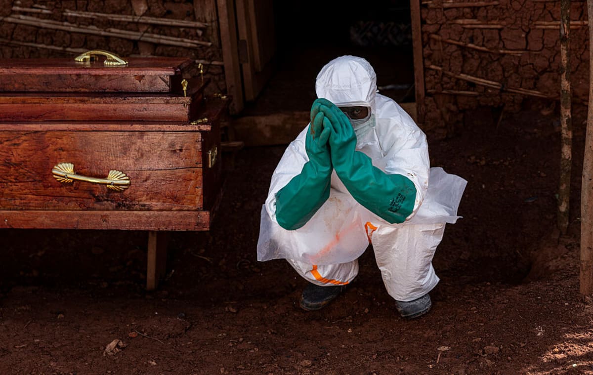 ** Health workers in protective gear responding to Ebola outbreak in Democratic Republic of Congo