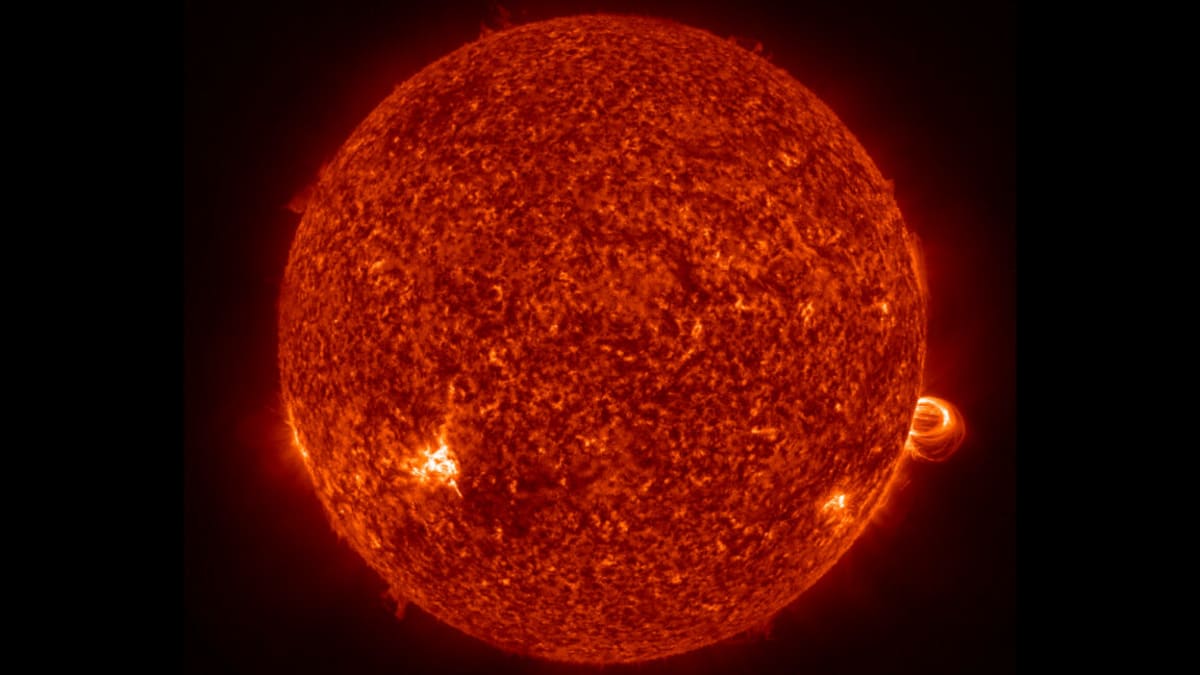 ** Artistic rendering of Earth bathed in sunlight with atmospheric systems visible from space