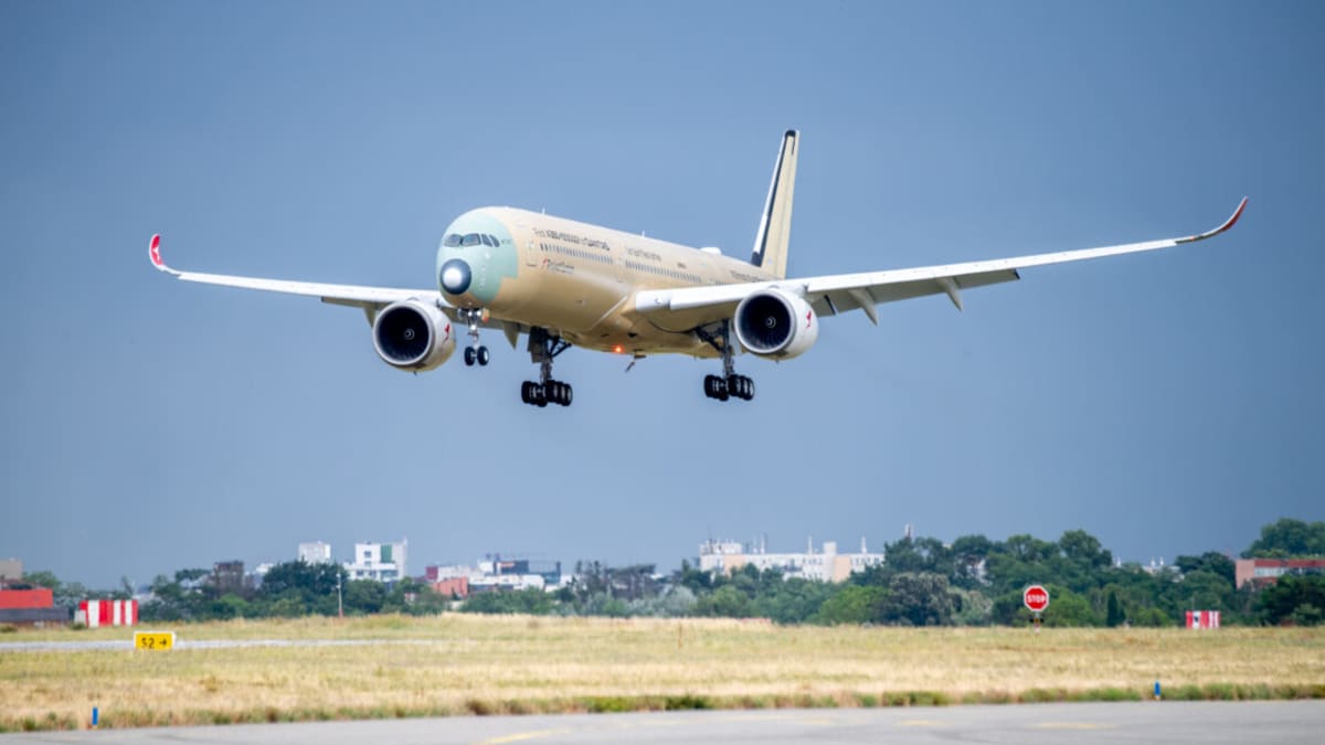White Airbus A350-1000ULR aircraft in flight against blue sky during record-breaking test journey