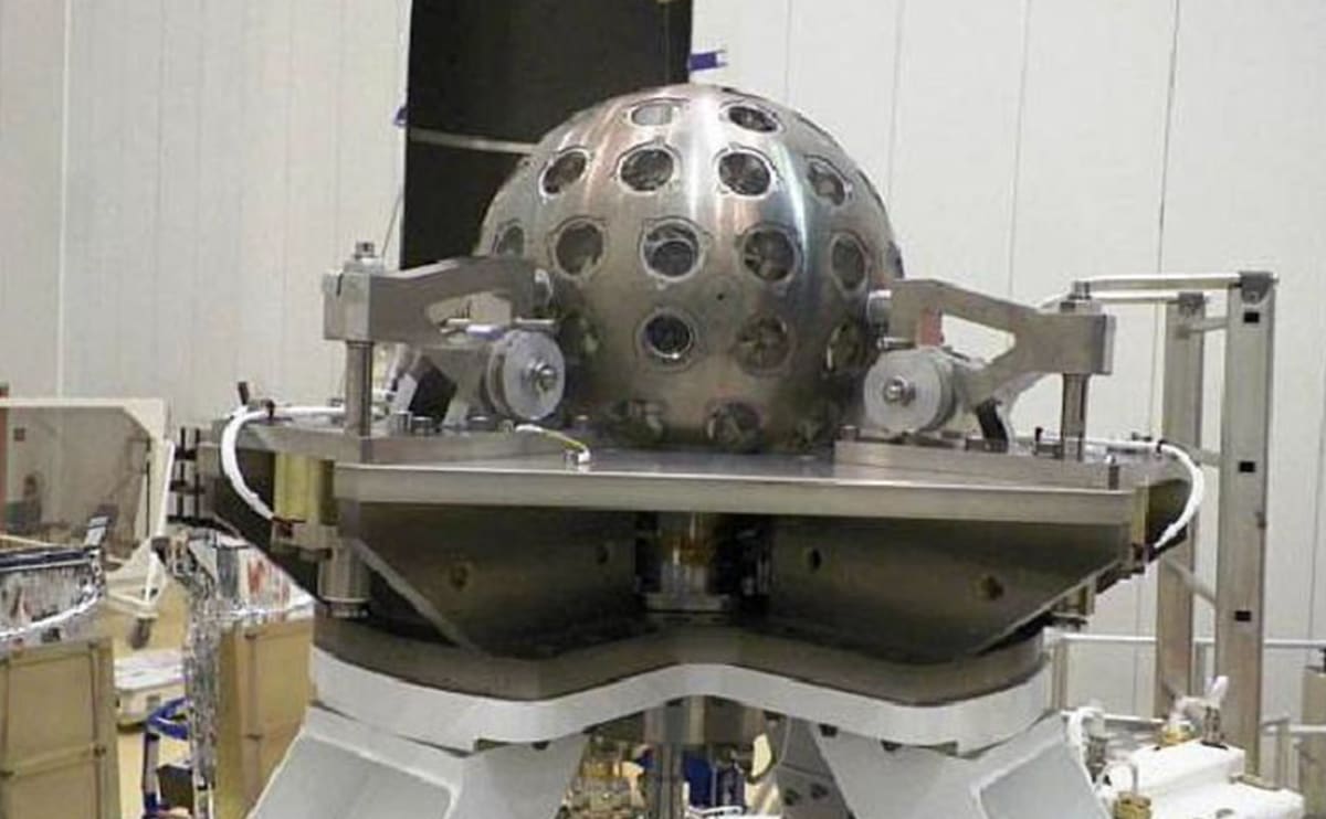 Silver spherical LARES-2 satellite covered in hundreds of cube-shaped laser reflectors orbiting Earth