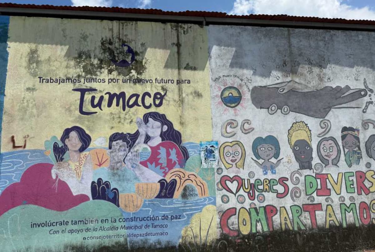 Colorful community mural painted on wall in Colombian territory affected by peace agreement