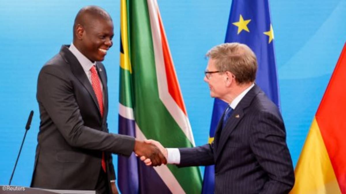 ** South African Foreign Minister Ronald Lamola shaking hands with German counterpart Johann Wadephul in Berlin