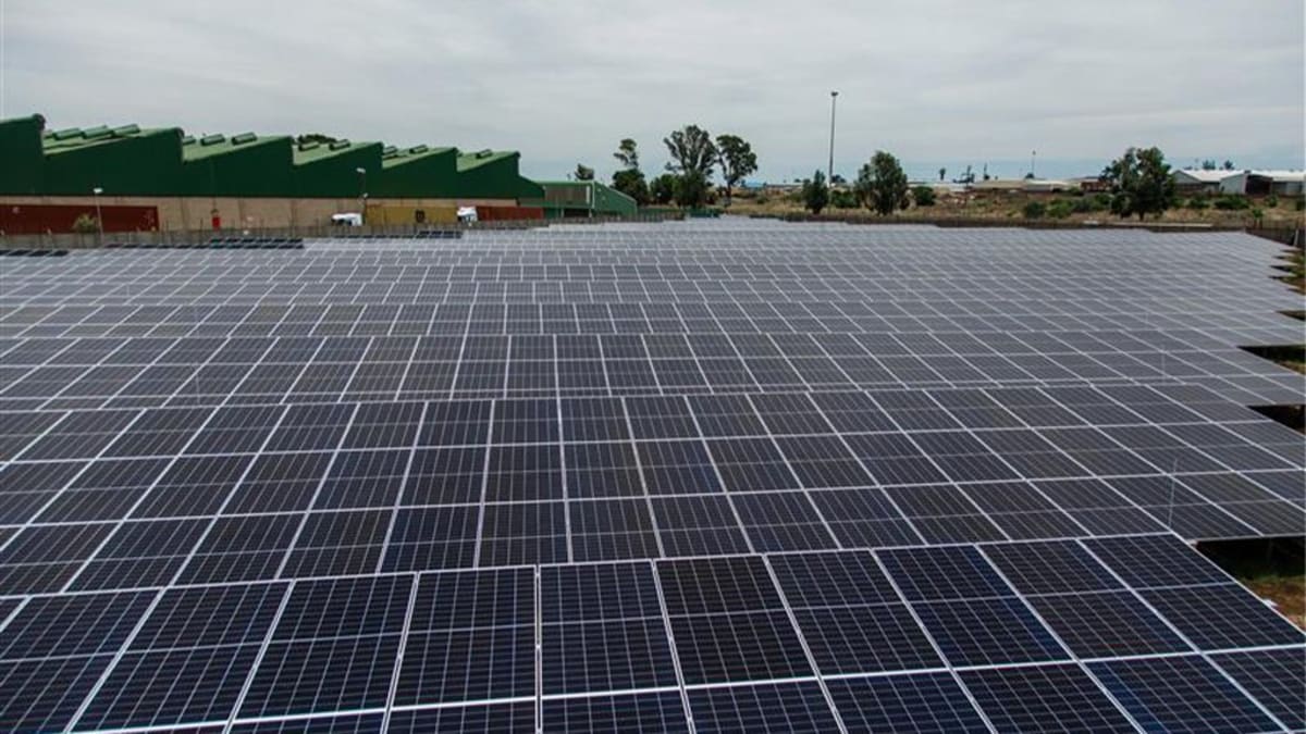 ** Solar panels covering industrial factory roof in Alrode, South Africa manufacturing facility