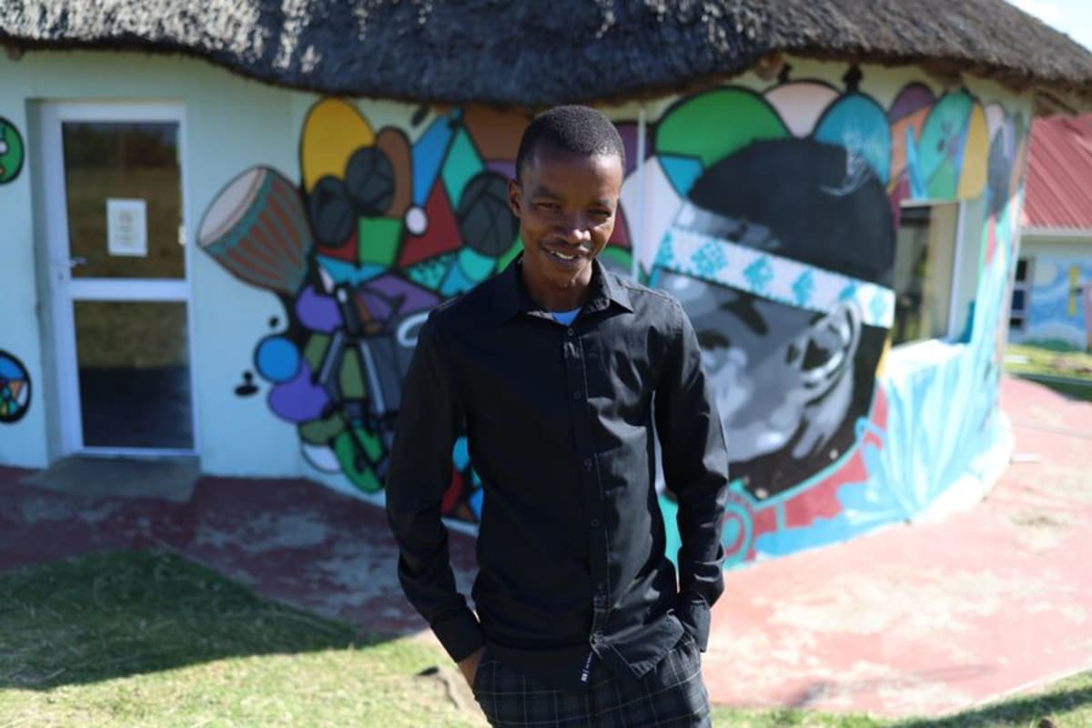 Sikelela Thobigunya managing broadcasts at colorful Bulungula Community Radio station in rural Eastern Cape