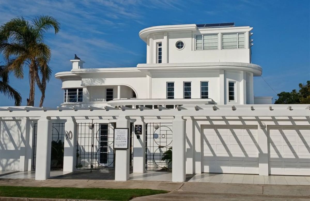 Art Deco style GFI Gallery building with curved walls and distinctive iron gates in Gqeberha, South Africa