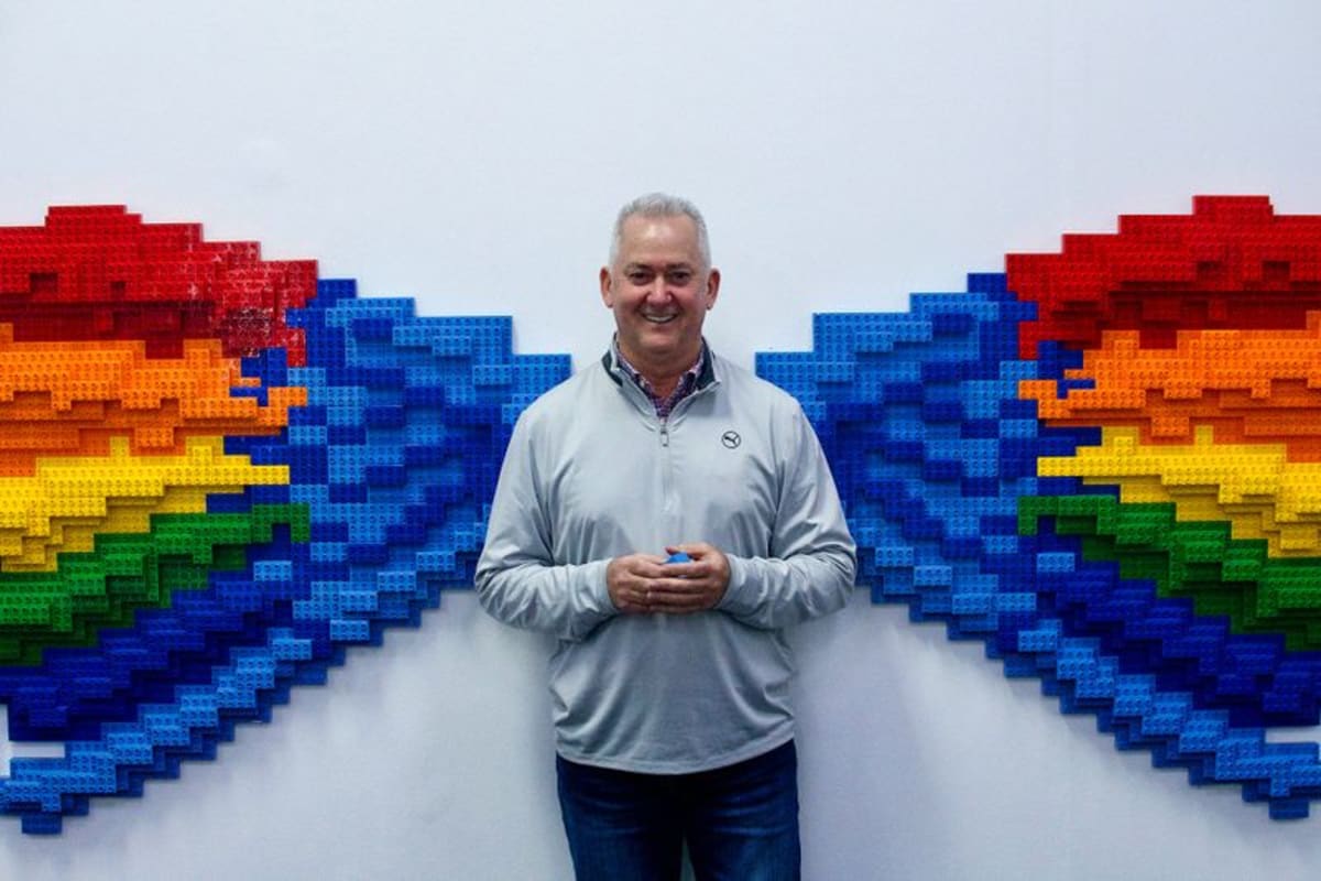 South African educator Brent Hutcheson holds plain Lego bricks used in Six Bricks teaching method