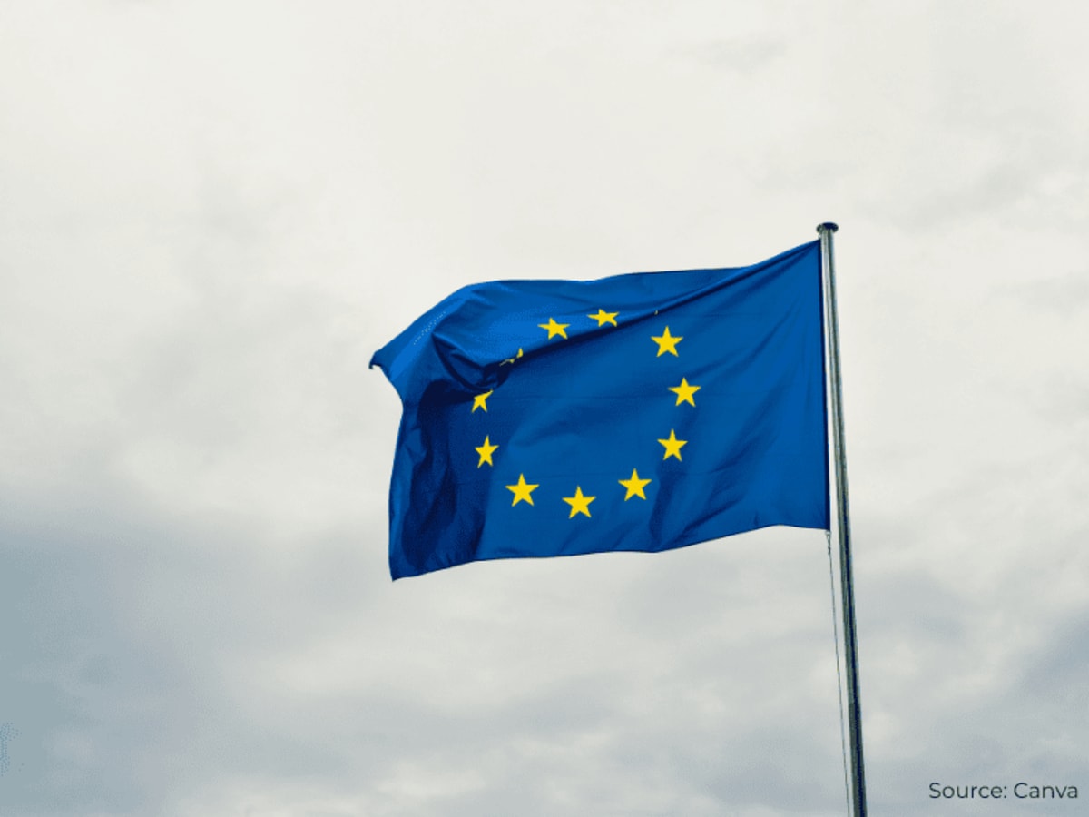 Solar panels and wind turbines on modern European renewable energy infrastructure with power grid