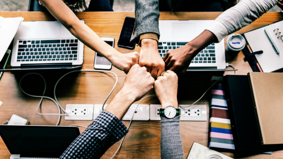 Young Nigerians networking and collaborating at youth gathering event in Lagos, Nigeria