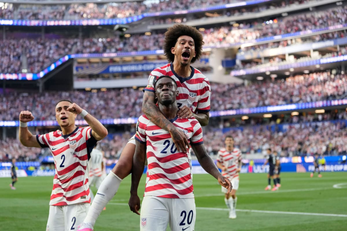 United States soccer player Folarin Balogun celebrates scoring goal with teammates during 2026 World Cup match