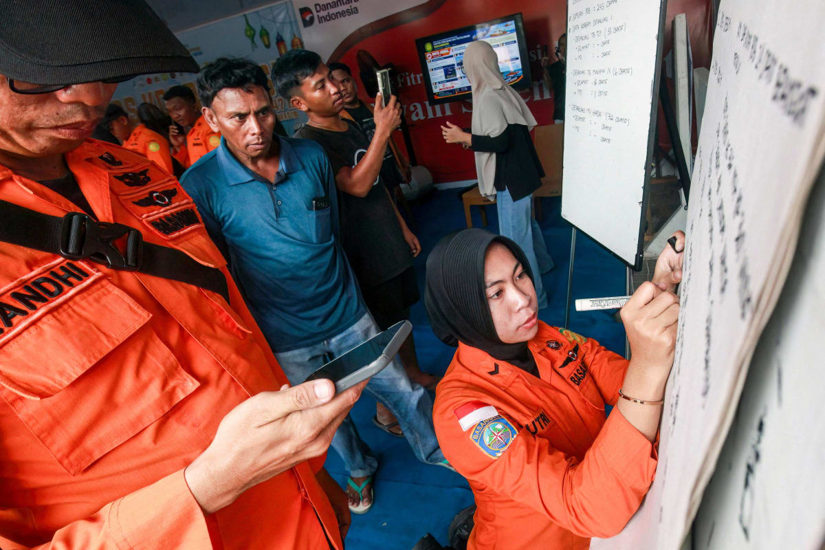 Indonesian rescue vessel navigating rough seas during emergency passenger ship evacuation operation