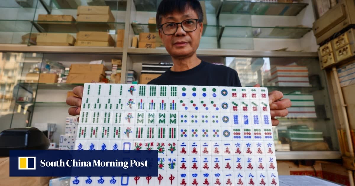 Master craftsman Ko Yun-kan hand-carving traditional mahjong tiles at his Hong Kong workshop