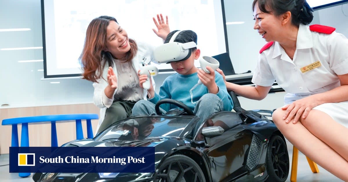Young boy wearing virtual reality headset smiling at Hong Kong Children's Hospital