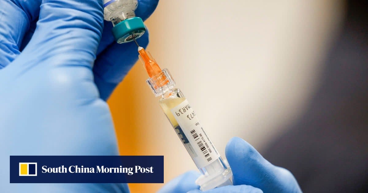 Healthcare worker administering measles vaccine to young child in Bangladesh vaccination campaign