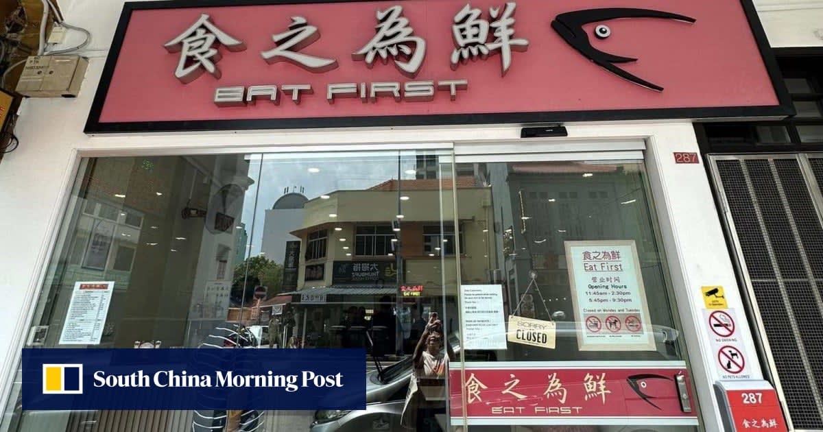 ** Cantonese zi char restaurant storefront in Singapore's Geylang neighborhood with outdoor seating