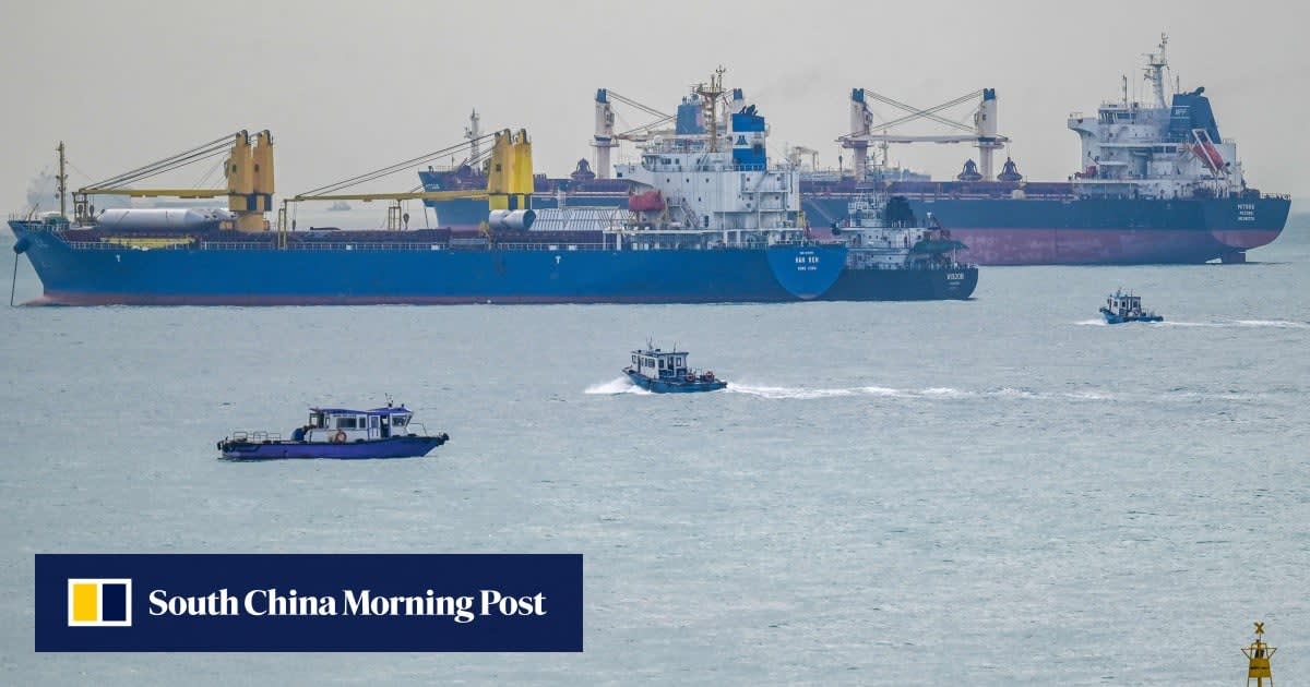 Aerial view of cargo ships passing through the Straits of Malacca and Singapore waterway