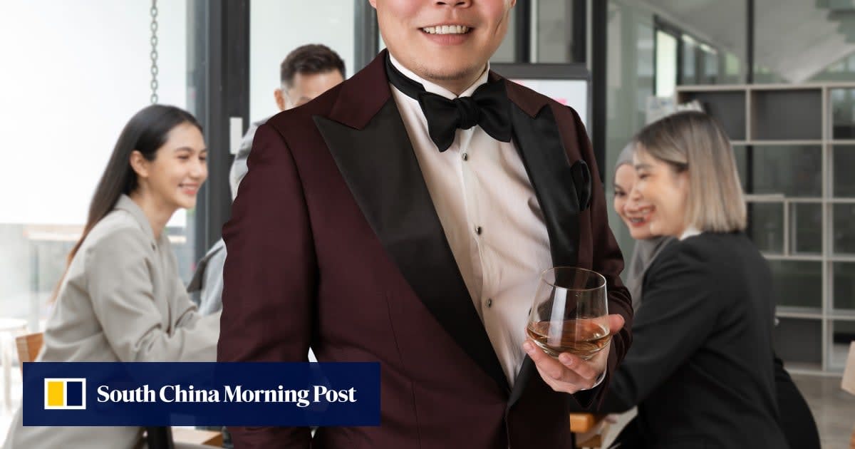 Young professional working comfortably in modern, relaxed office environment with natural lighting