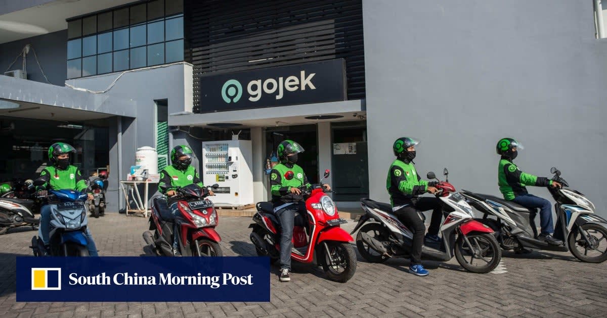 Indonesian ride-hailing drivers gathered at Labour Day rally in Jakarta listening to President Prabowo