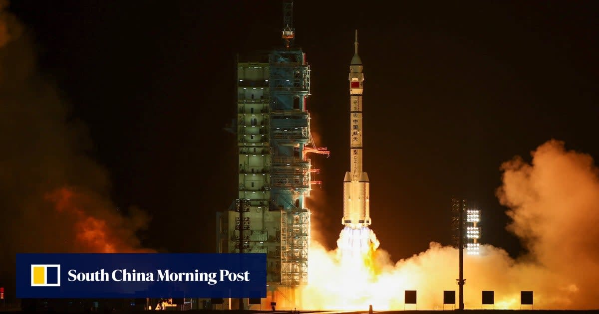 Long March-2F rocket launching Shenzhou-23 spacecraft into night sky from Jiuquan launch center
