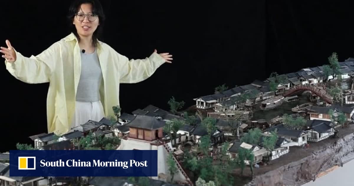 Detailed chocolate sculpture showing ancient Chinese city with miniature buildings, people, and boats