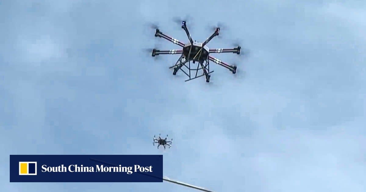 Heavy-duty industrial drone carrying construction materials over Hong Kong building site
