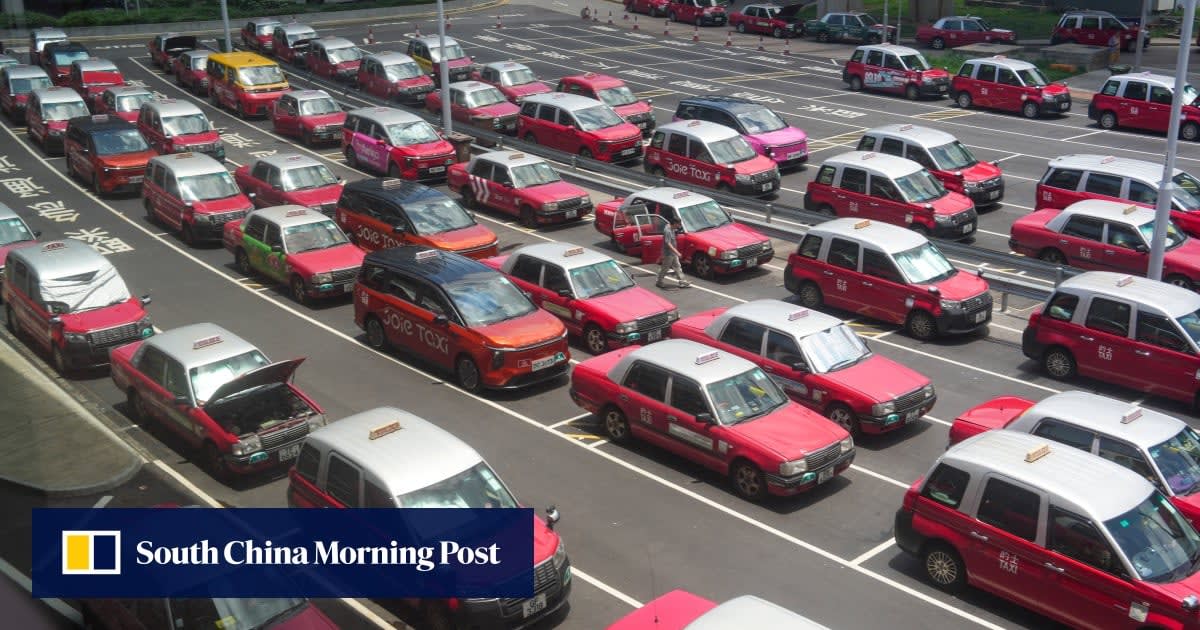 Hong Kong taxi driver using digital display showing AI-powered passenger demand predictions across city zones
