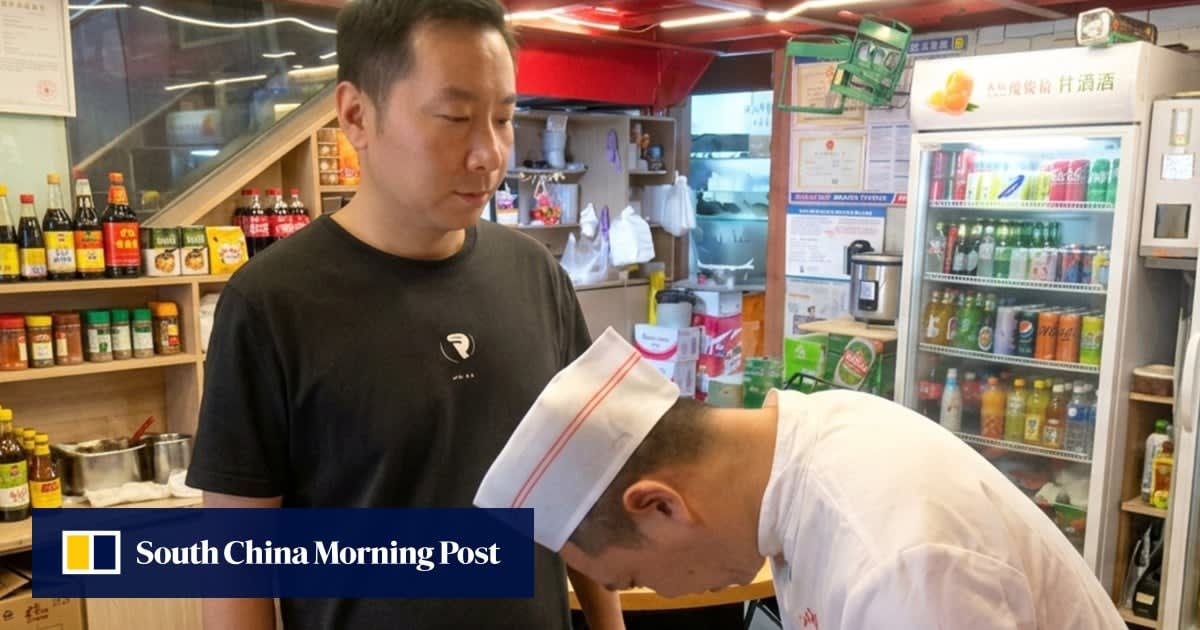 Restaurant owner Liang and chef Liu working side by side in reopened kitchen
