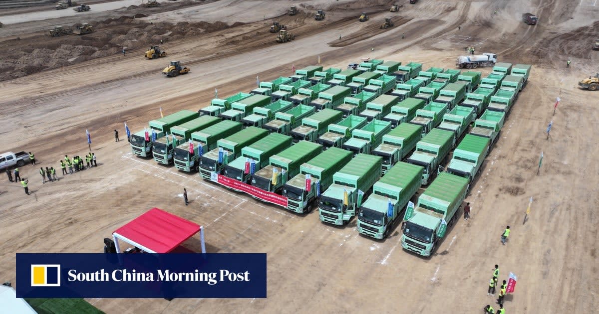 Modern electric heavy-duty truck charging at station in China transportation hub
