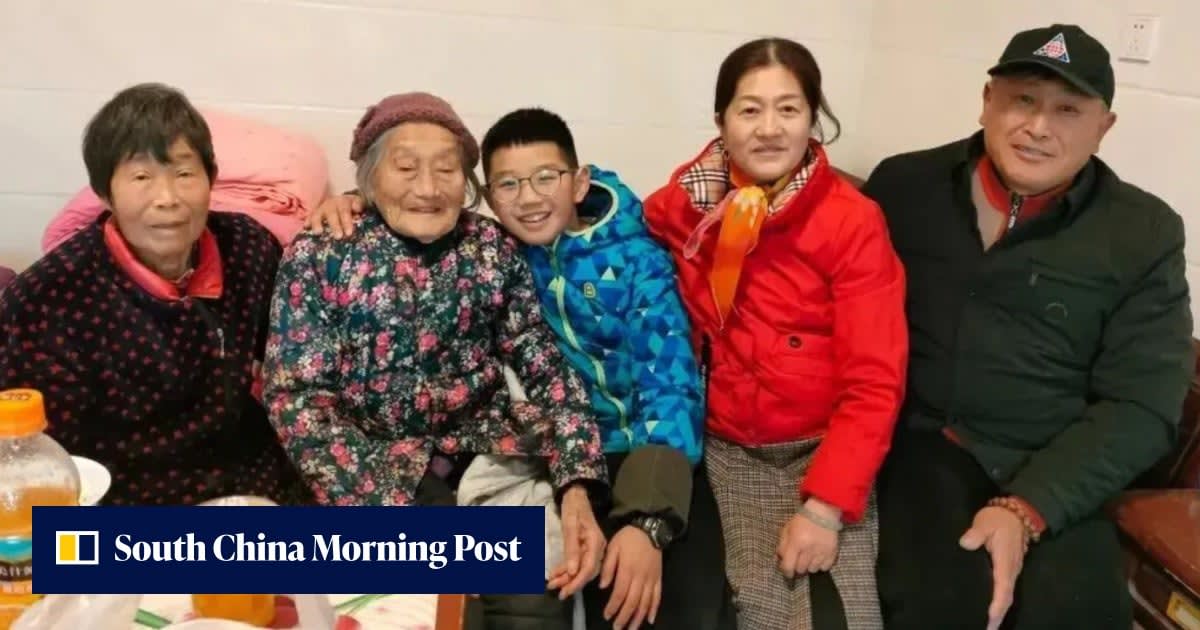 Elderly Chinese woman Wang Gaiying smiling while doing light housework at home