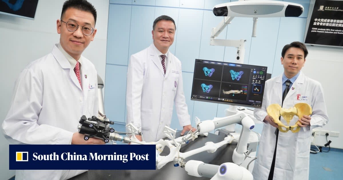 Robotic surgical arms positioned over operating table in modern Hong Kong hospital room
