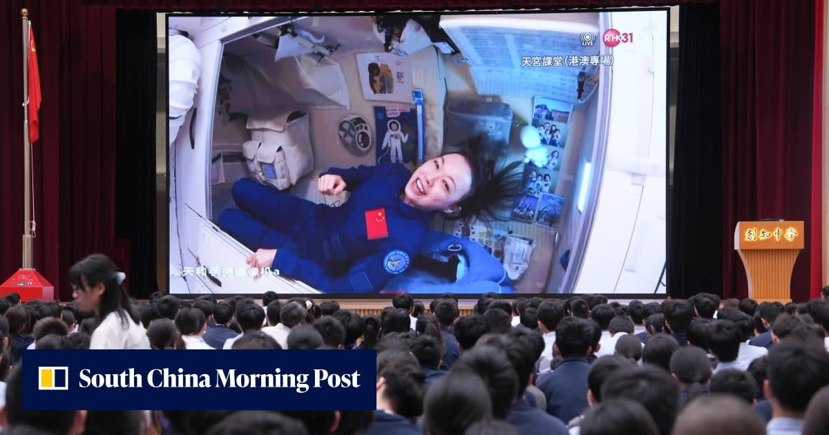 ** Hong Kong astronaut Lai Ka-ying floating in space station during live educational broadcast to students