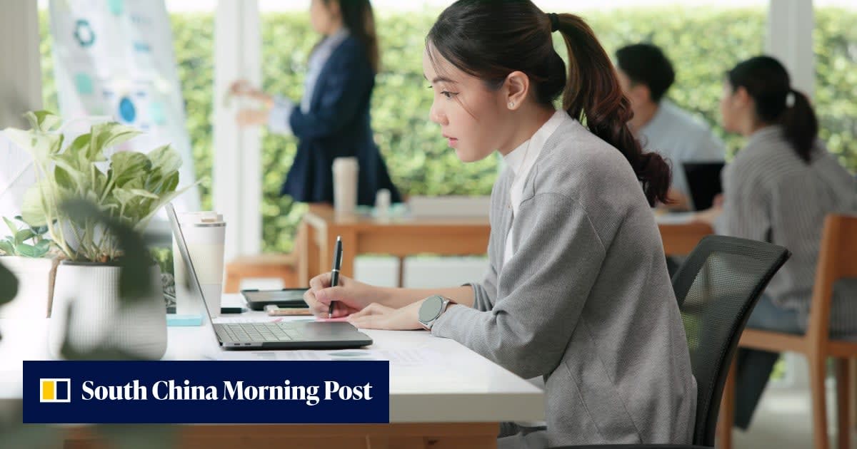 Young professional working peacefully at laptop in comfortable home office setting