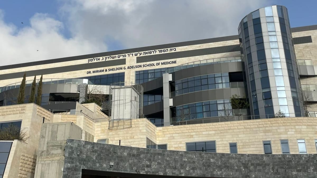 Medical students in white coats studying together at Ariel University in Israel