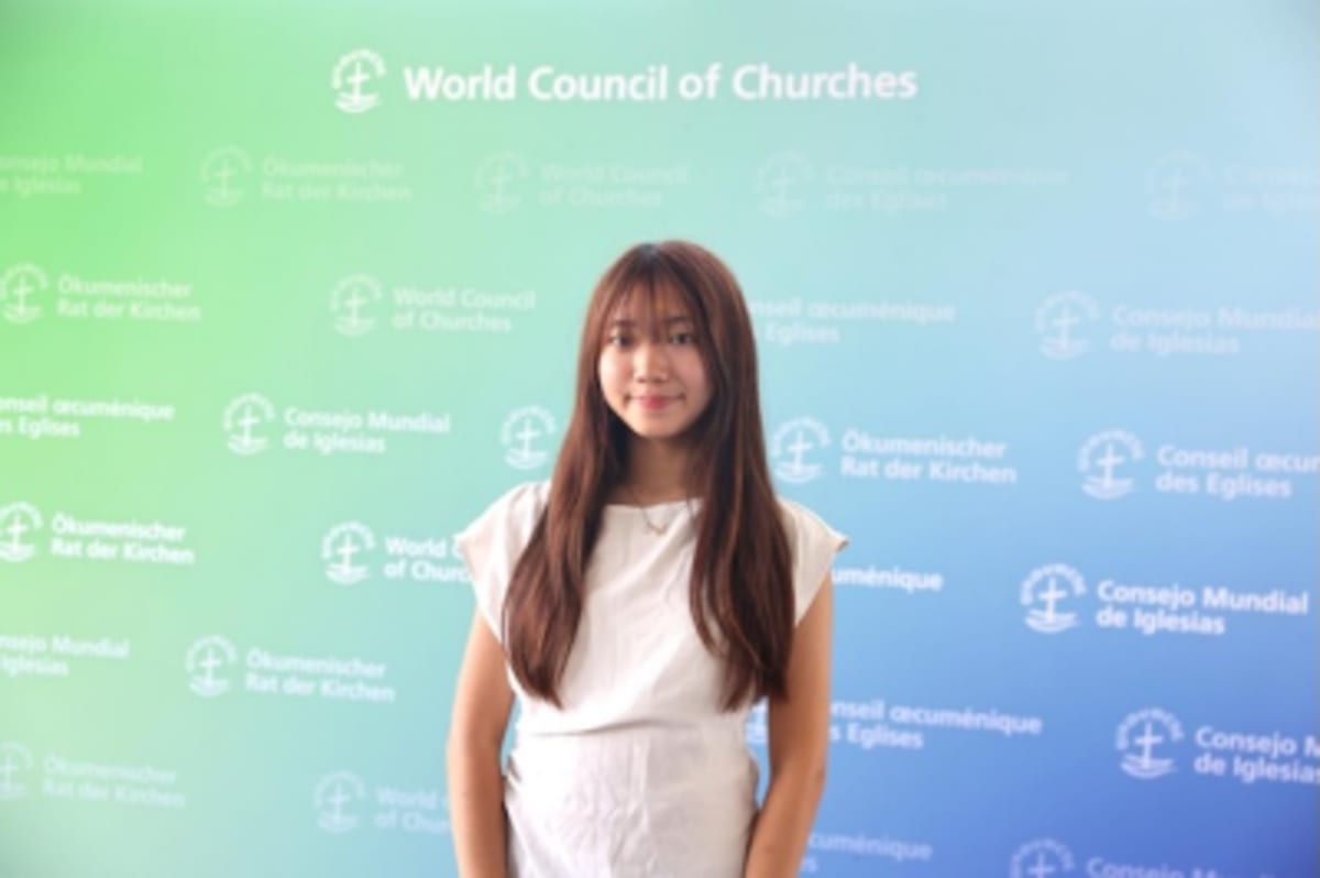 Young Japanese-American woman sharing her grandfather's Hiroshima atomic bomb survival story at World Council of Churches
