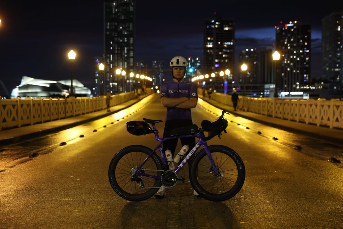 Endurance cyclist Bond Almand riding bicycle on cross-country journey to NFL stadiums