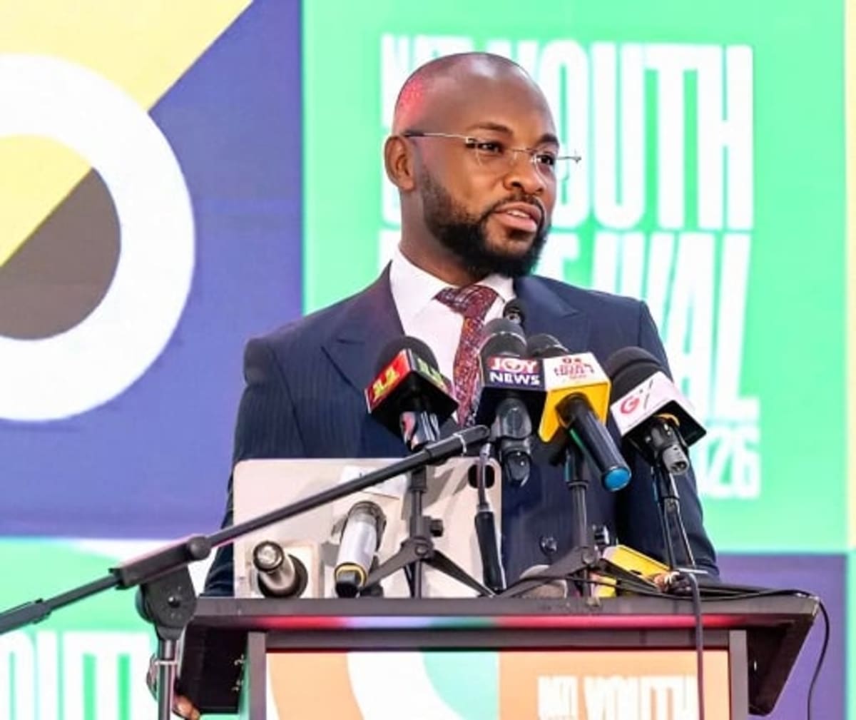 Young Ghanaian conference participants gathered at university auditorium discussing national development initiatives