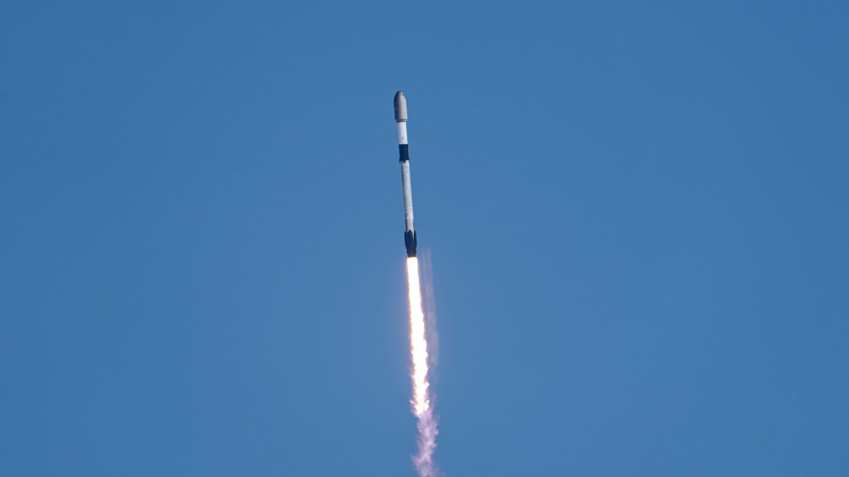 Falcon 9 rocket launches through fog from Vandenberg Space Force Base carrying Starlink satellites