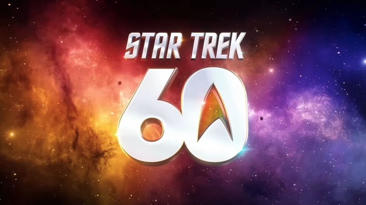 Crowd of Star Trek fans performing the iconic Vulcan hand salute at anniversary celebration