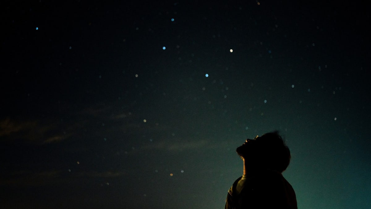 The Big Dipper constellation against dark starry sky showing navigation lines to other stars