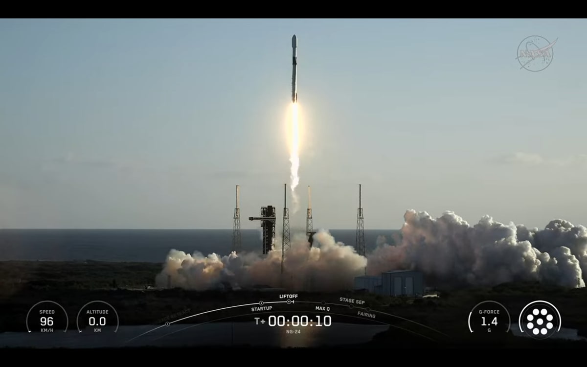 SpaceX Falcon 9 rocket launching Cygnus XL cargo spacecraft into blue sky over Florida
