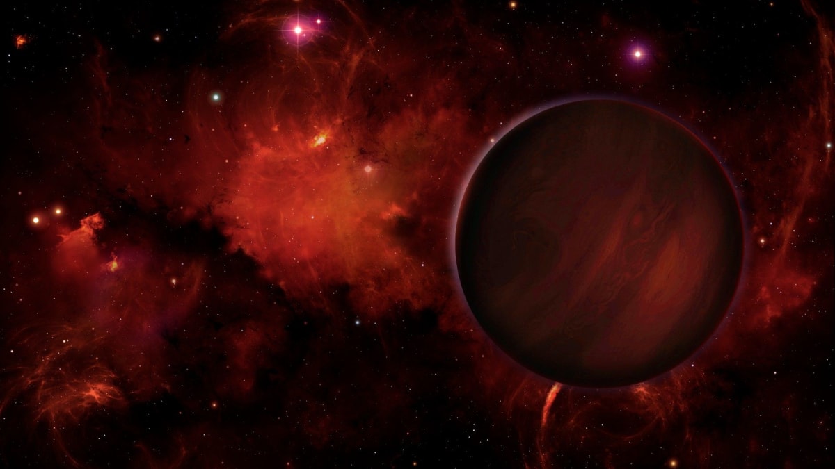 Illustration of a free-floating rogue planet with moon drifting through dark interstellar space