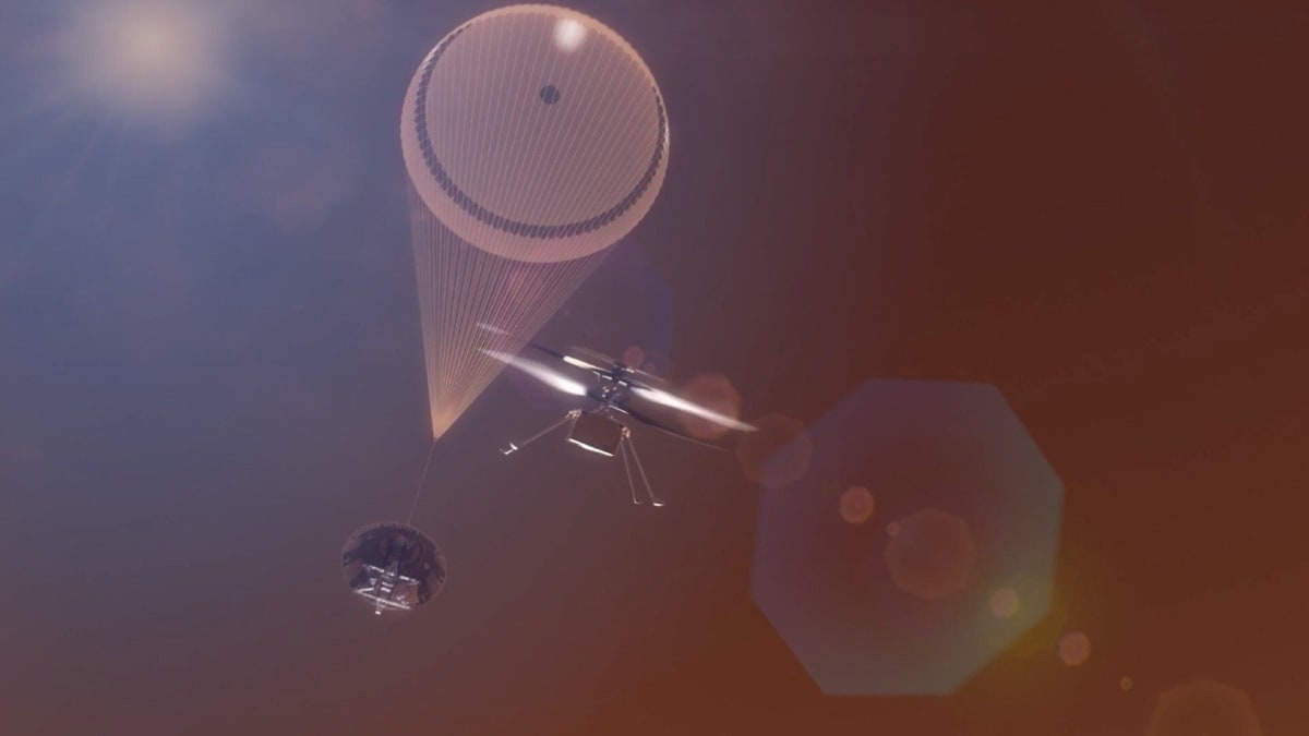 Engineer inspects large carbon fiber Mars helicopter rotor blade in NASA test facility