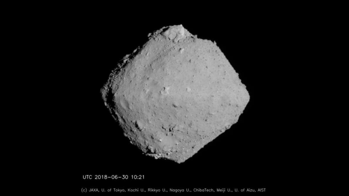 Artist rendering of asteroid Ryugu, a spinning-top-shaped space rock containing DNA building blocks
