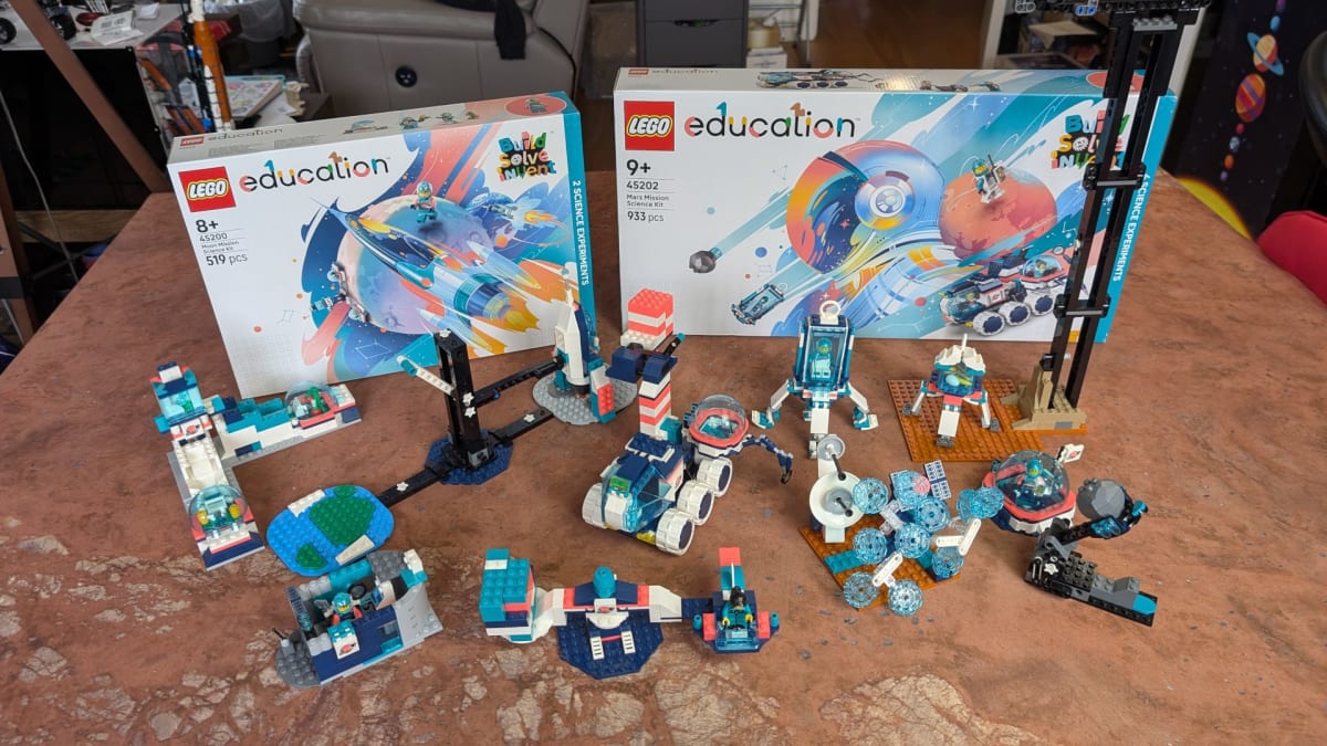 Colorful Lego Education space mission sets with teal, blue, and pink building blocks arranged on table