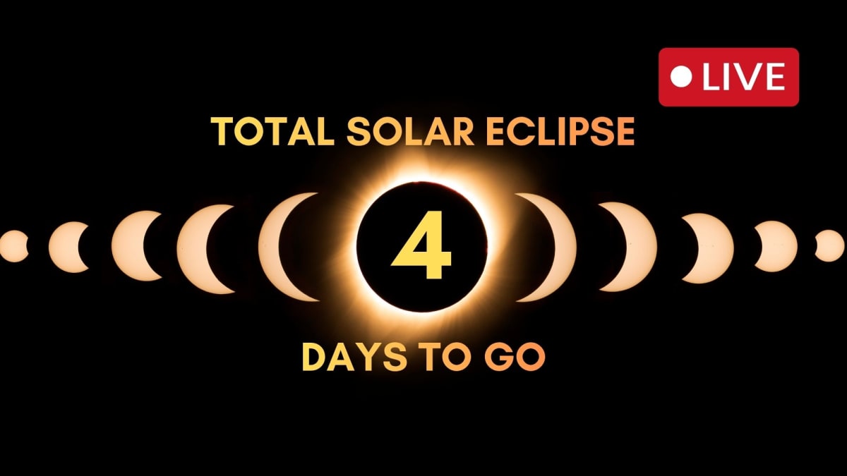 Total solar eclipse showing moon completely covering sun with glowing corona visible around dark lunar disk